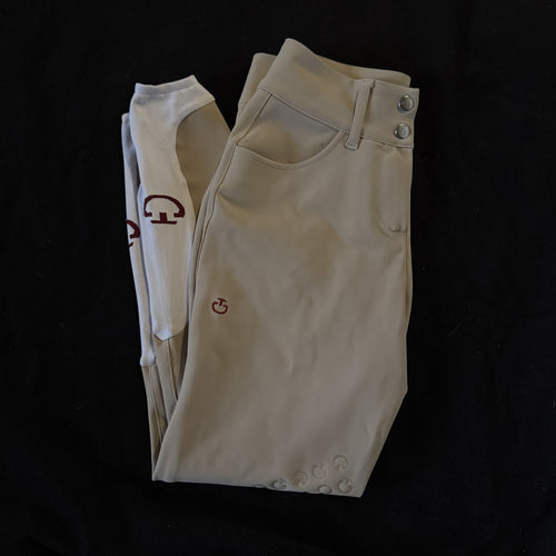 Beige pants with floral patterns on a black background